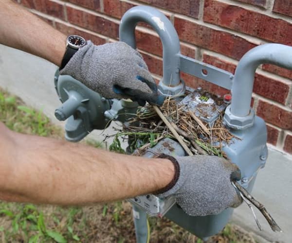 natural gas meter gloved hands